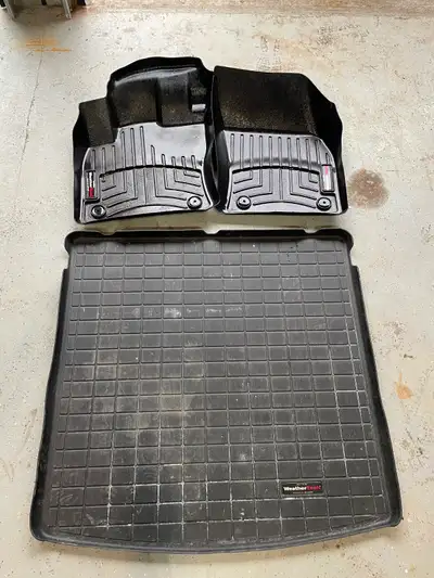 Selling driver, front passenger and cargo floor mats for a VW Tiguan. This should fit all second gen...