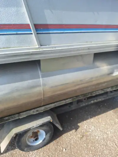 Pontoon for sale good toons good motor and trailer needs needs floor and some love.