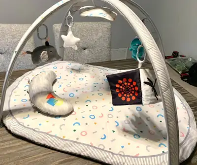 This is a baby play gym with mat and toys designed to stimulate your baby's development through inte...