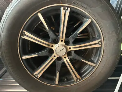 Aftermarket rims off Chevy Cruze tires not perfect but some summer driving in them asking $200