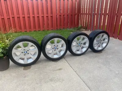 Sport 18inch BMW staggered rims with tires rears 265/35ZR18 fronts 225/40ZR18 85% treads on tires.