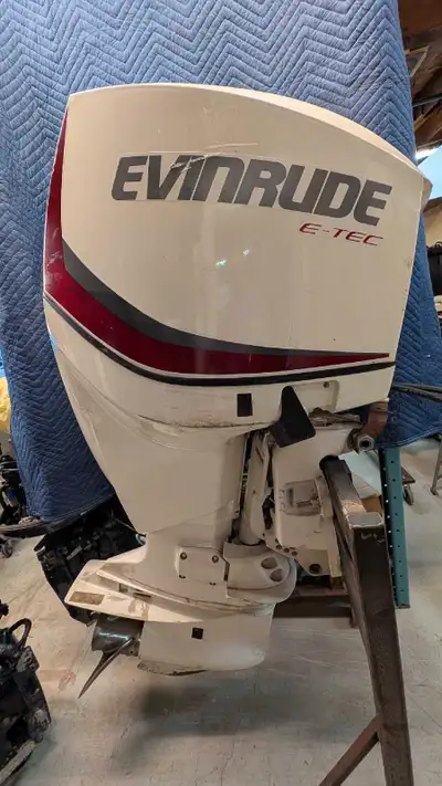 Evinrude E-TEC 150hp outboard motor with 546 hours, perfect for upgrading your boat. It has some cos...
