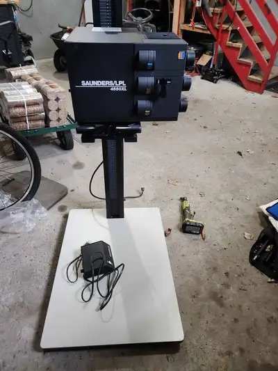 Saunders enlarger. this is a beast of an enlarger, it is for 4 by 5 and smaller, comes with a 35mm f...