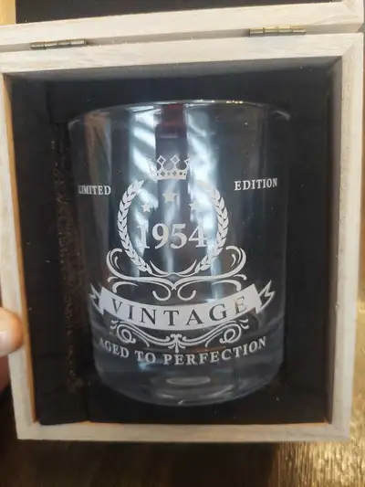 This is a used, limited edition whiskey glass commemorating the year 1954, and comes in a commemorat...