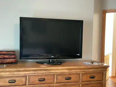 42 “ LG TV with remote and stand, View more