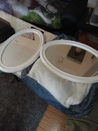 2 large oval mirrors 