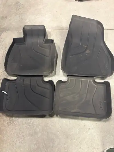 Keep your vehicle clean this winter with these used BMW X1 winter floor mats from a 2018 X1. Only us...