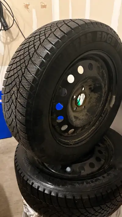 Set of 4 winter tires, size 235/55R17 (99H), mounted on steel rims. Used for approximately 2 months,...