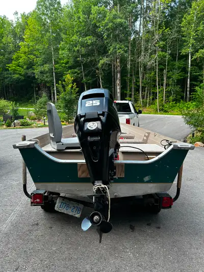 14' Legend wide body fishing boat with 25hp Mercury 4 stroke with trailer . 150 hrs max on engine