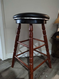 Bar stool with leather seat.  Chair