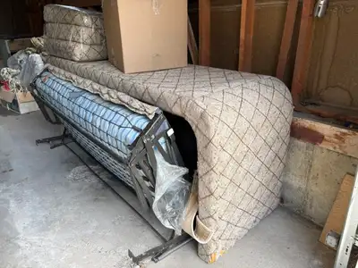Free, four-seat sofa bed. The front of the armrests are damaged from cats scratching, but they could...