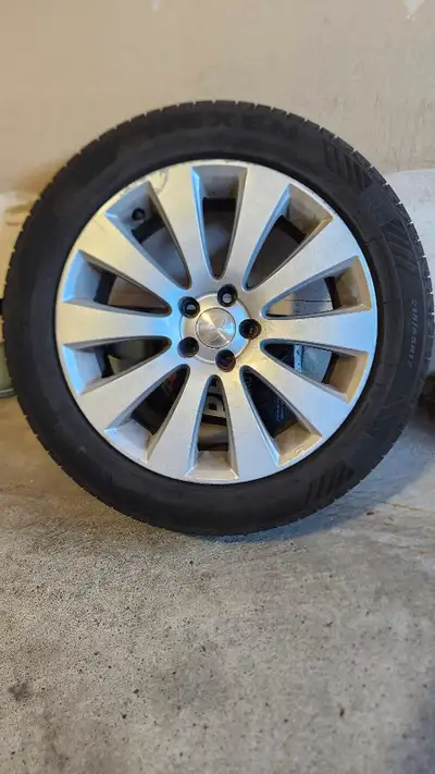Nexen Nfera P215/55 R17 all season tires on Subaru rims, 2 years old, driven only within the city an...