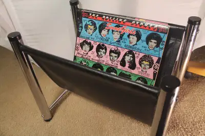 Circa 1970 glistening, sleek chrome and pleather holder for vinyl, magazines, newspapers, towels or...