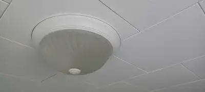 Two white ceiling fixtures 