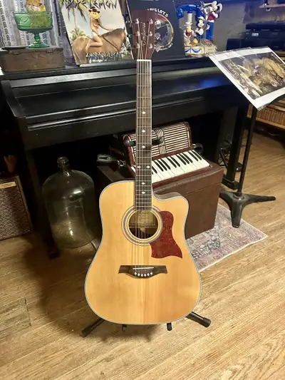 $800 obo Comes with case Body & Bridge: Shape: Dreadnought Cutaway Finish: Natural Satin, Open Pore...