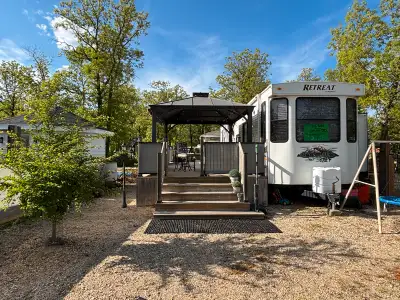 40 ft Destination Trailer with large 2-tier deck, bunkie, shed, and more on a Seasonal Site. (Can pu...