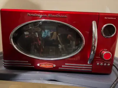 Moving Sale! 2 Microwaves for sale! - Nostalgia Electrics microwave (red) is used but in great condi...