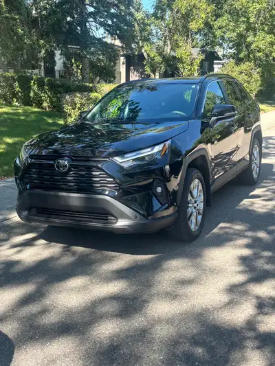 Practically brand-new 2025 Toyota RAV4 XLE AWD with only 19,990 km. Metallic black. Professionally d...