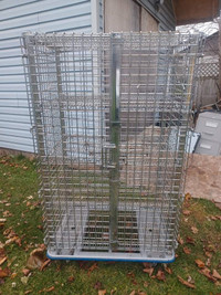 Large metal cage with 4 shelves on wheels for sale 