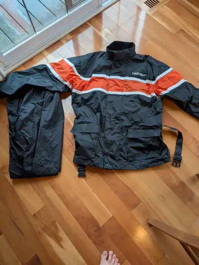 Two Teknic motorcycle rain suits, excellent condition, only got caught in the rain once. Black with...