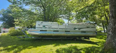 2003 24 foot pontoon boat with 2001 60hp mercury outboard motor. Everything works but the seating sh...