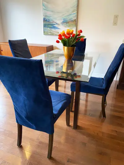 Gorgeous blue velvet chair set with pristine glass dining table, View more