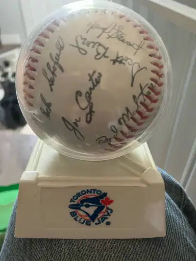 Stamped Blue Jays baseball from ‘92 or ‘93 World Series. 25 signatures in total, in a protective cas...