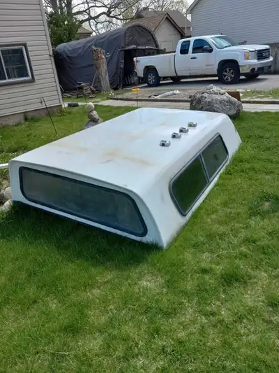 8 ft pickup truck cap with six lockdown c-clamps if needed , even though picture shows four