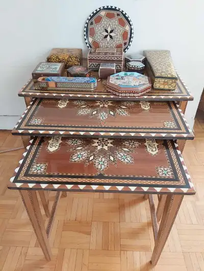Oriental collection of wooden objects. Three stackable syrian inlayd coffee tables. There is a Large...