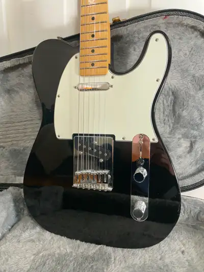 An affordable Fender classic. A snappy maple neck and solid alder body, with a black gloss finish an...