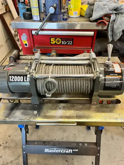 12000 LB badlands winch brand new. Comes with roller fair lead wireless remote and snatch block. Cal...