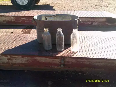 Square glass milk bottles. $50 each. Copper boiler $ 160 . Holds water.