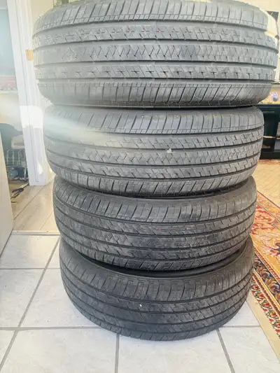 4 Summer Bridgestone tires with Rims 235-60R18 103 NEW used once $900 neg.