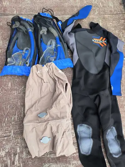 2 packs of swimming feet and glasses. A small to medium air life jacket A wetsuit. Medium I think. O...