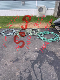 Four used garden hoses
