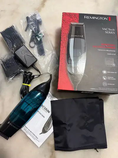 NEW Vacuum Trimmer and Hair Clipper Description: Brand is Remington Model HKVAC2000B 18-Piece Vacuum...