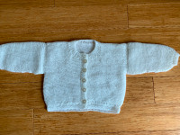 Hand-knitted white Cardigan.