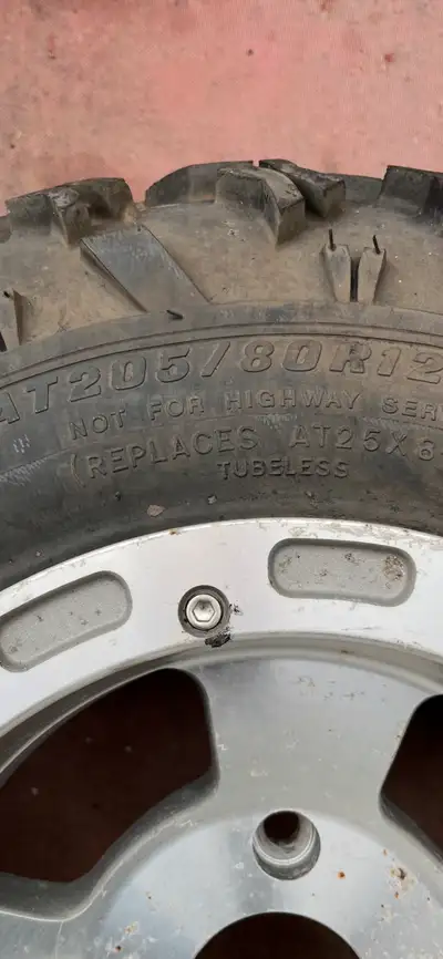 Four rims and tires, new center caps and lug nuts included , see pics for sizing, came off arctic ca...