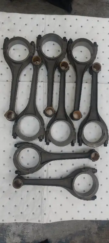 Set of 8 good used Ford 239 Flathead connecting rods. Big ends have been resized and new pin bushing...