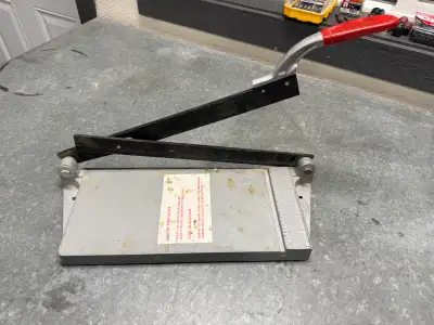 This is a used QEP Professional Ball-Bearing Vinyl Tile Cutter, capable of cutting tiles up to 12" x...