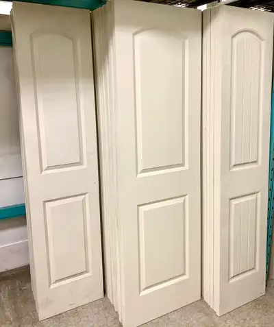 Primed 2 Panel Arch Smooth and Planked Interior Slab Doors Available sizes smooth & planked: 18x80 2...