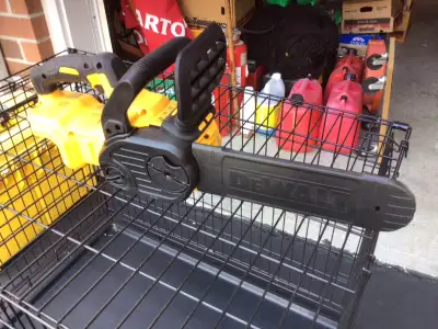 Dewalt battery operated mini saw.New with battery 12” blade, View more