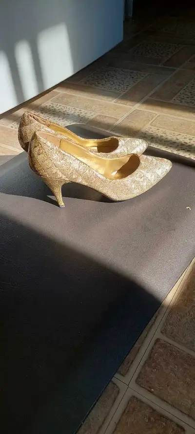 Brand new  high heels,  color gold, Size 8 1/2, View more