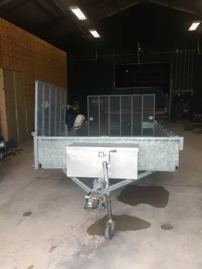 6x12 galvanized trailer. Rear and side loading ramps. Front mounted lockable storage box. Lots of D...