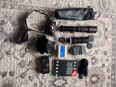 Canon ae-1 35mm camera 3 lenses Flash with accessories Photography book Carrying bag Misc. accessori...