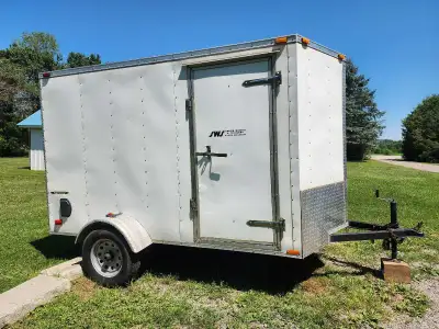 Enclosed utility trailer in great condition with some e tracks and strap hooks and a front tire moun...