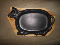 Cast iron serving plate with wooden base