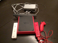 Nintendo Wii et accessoires, disques de jeux, volant, manettes.