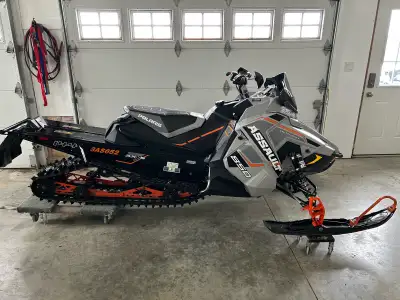 2020 Polaris Assault 850, 3005 miles, 144” 1.3” cobra track, studded, electric start. Always trailer...