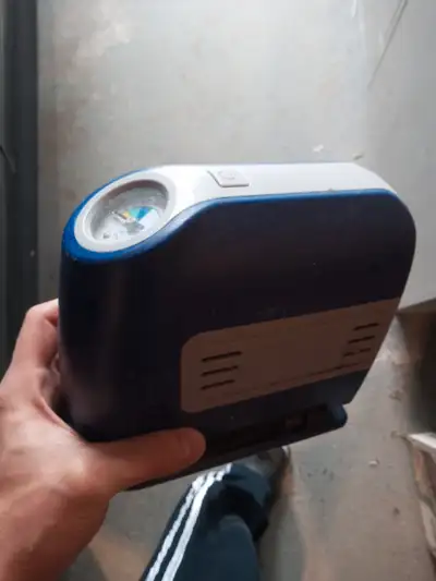 A car pump with a pressure sensor, and a light.